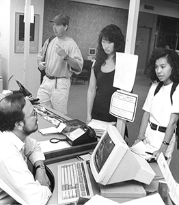 Students talking to librarians